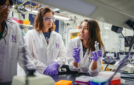 Three researchers in lab.